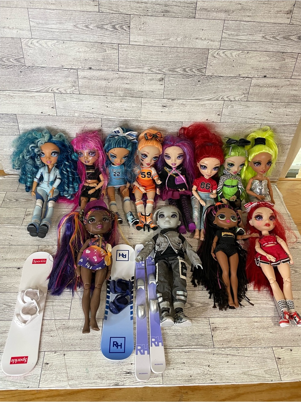 Lot of 12 Rainbow High fashion dolls, including popular characters